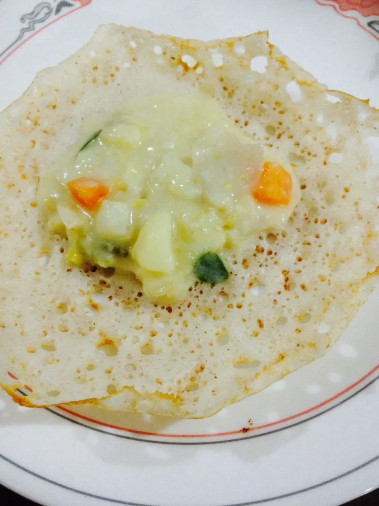 Kerala appam served with vegetable stew