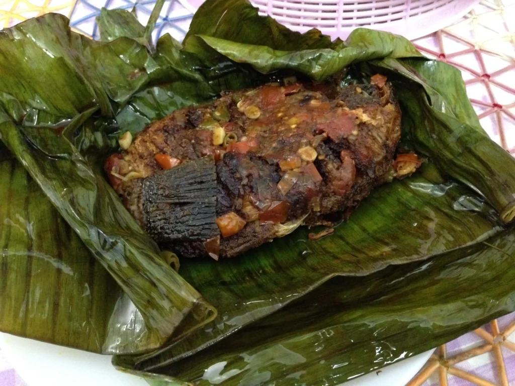 Karimeen pollichathu, Kerala-style pearl spot fish cooked in banana leaves