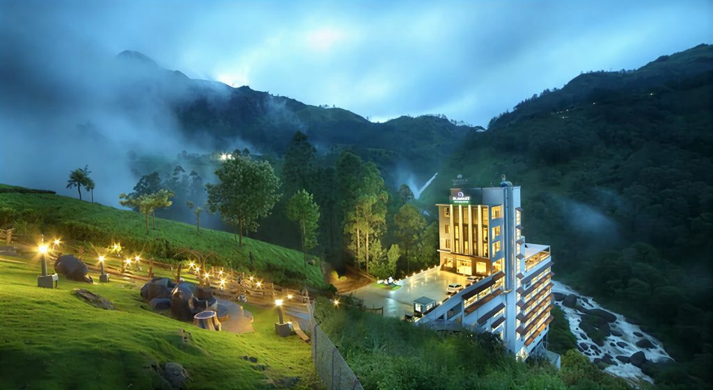 Cloud covered hills seen from luxury mountain resorts in India.