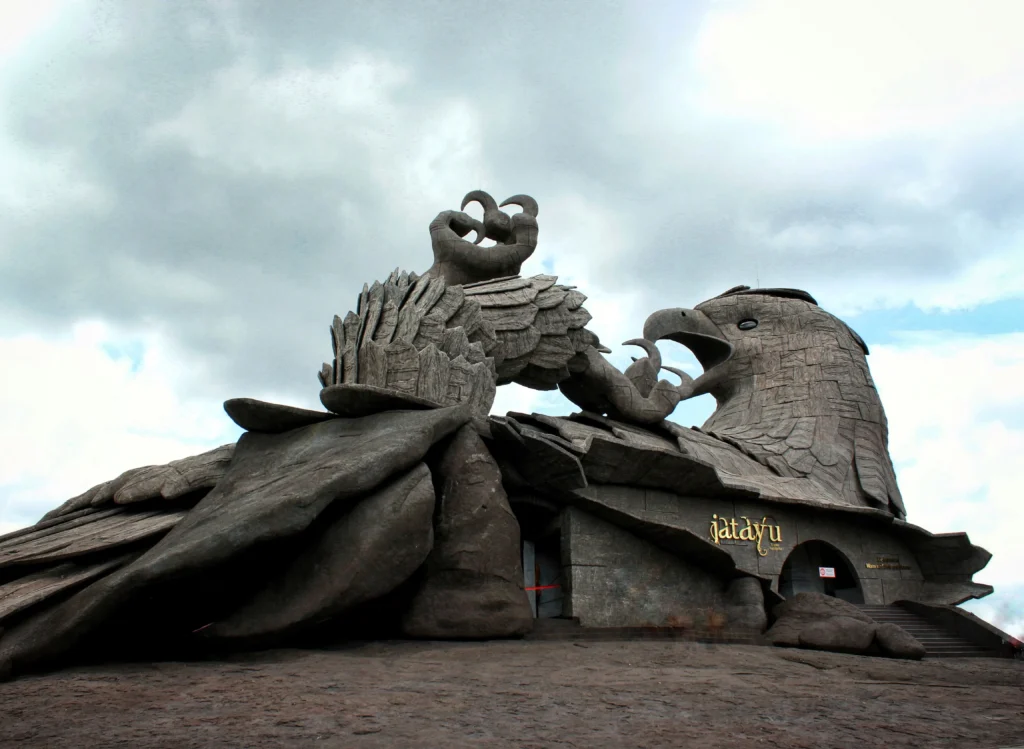 Jatayu Earth’s Center in Kollam featuring the massive stone sculpture of Jatayu, the mythical eagle from the Ramayana, under a cloudy sky.