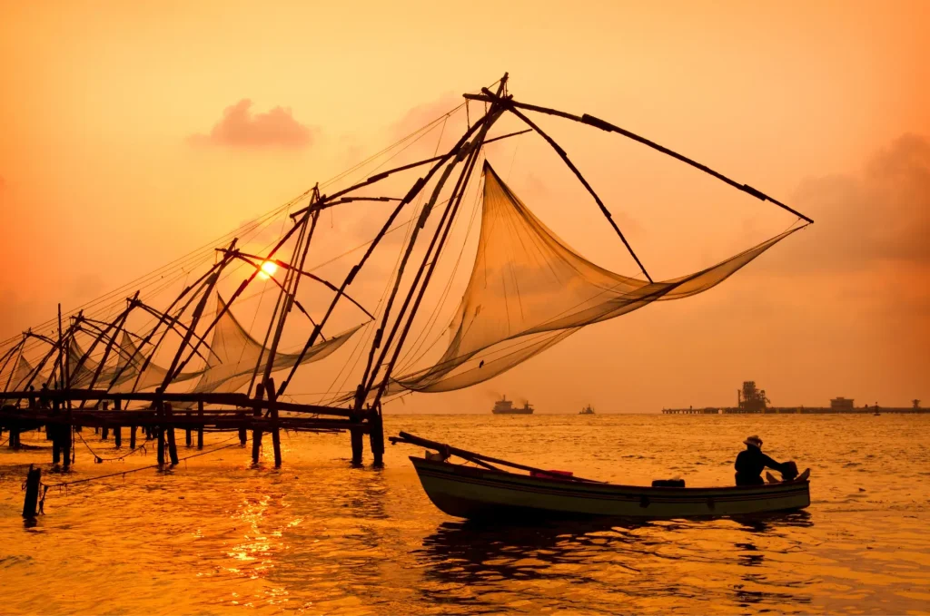 Chinese fishing nets at sunset among Kochi sightseeing places.